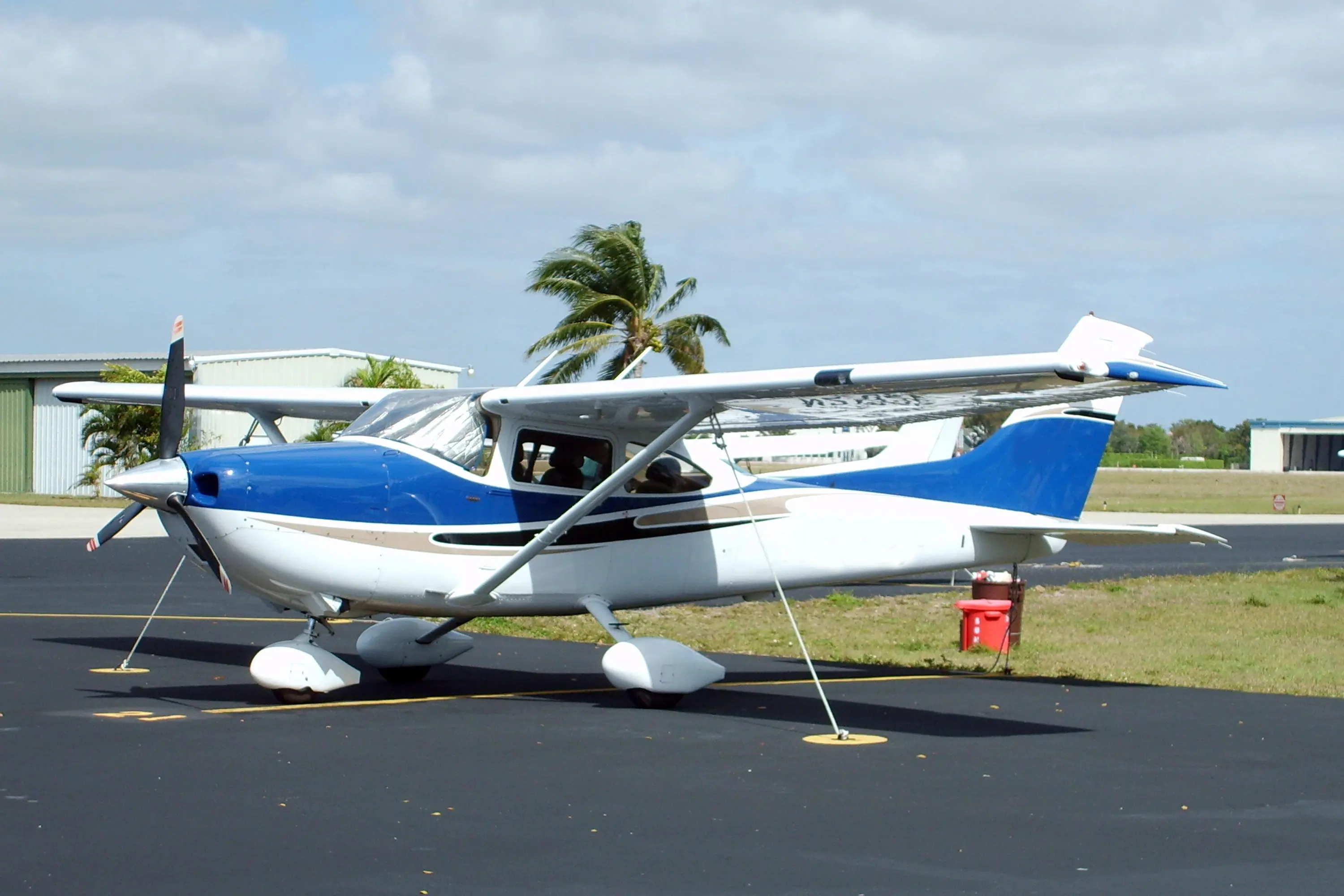 A small airplane sitting on top of an airport runway.
